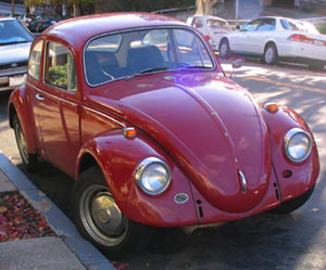 1967 VW Beetle with missing bumpers, left-side horn grill; this was the final year in the U.S. for the old bodystyle incorporating the updated headlights sourced from the Type 3.