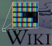 Wikipedia's logo displayed on an LCD monitor.
