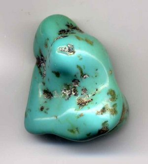 Turquoise pebble, one inch (2.5 cm) long. This pebble is greenish and therefore low grade.