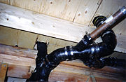 Cast iron drain, waste and vent piping in a Canadian timber-frame building in Mission, British Columbia in the 1980s.