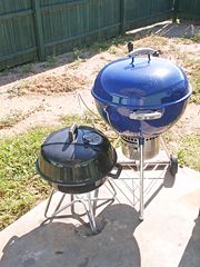 Two charcoal kettle grills, a small 18-inch tabletop model, and a freestanding 22.5-inch model.