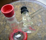 A very common straight bore glass stopcock attached with a plastic plug retainer.  This stopcock is in the side arm of a Shlenk flask.