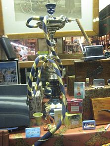 A hookah and a variety of tobacco products are on display in a Harvard Square store window in Cambridge, Massachusetts, United States.