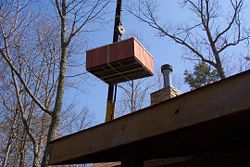 Using a crane is a common method of installing a one piece hot tub