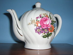 A teapot with floral design
