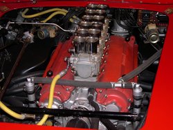 Colombo Type 125 "Testa Rossa" engine in a 1961 Ferrari 250TR Spyder with 6 Weber 2 barrel carburetors intaking air through 12 "trumpets" visible on top of the engine, one individually adjustable barrel for each cylinder; the ultimate in tunability.