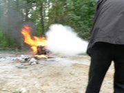 fighting a petrol fire with a foam extinguisher