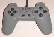 An original PlayStation control pad, heavily inspired on Super Nintendo joystick. This model was later replaced by the Dual Analog, and then the DualShock.