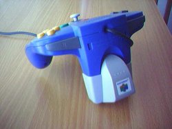 A Nintendo 64 gamepad with Rumble Pak attached.