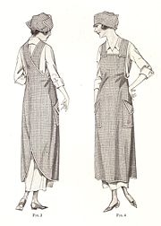 Woman of the 1920's wearing a full-length house apron with criss-cross straps.