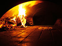 A wood-burning pizza oven.