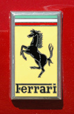 The Ferrari Gestione Industriale badge on the front of a 330 GTC