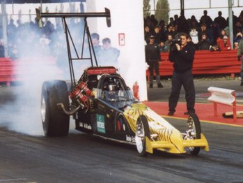 A Top Fuel dragster, the ultimate in drag racing. Get too close without ear protection and it will cause deafness.