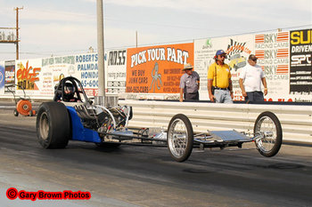 Front engine dragsters are what they raced in the 1960's. These cars are still in competition today and they attract big crowds. This car would've been a Jr. Fueler in the 1960's.