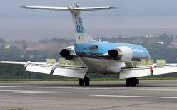 KLM Fokker 70,  showing position of flap and airbrake/spoiler flight controls.The airbrakes/spoilers are the lifted cream-coloured panels on the wing upper surface (in this picture there are five on the right wing). The flaps are the large drooped surfaces on the trailing edge of the wing