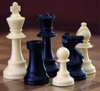 The game of chess, which requires a chess set and consists of nearly pure strategy.
